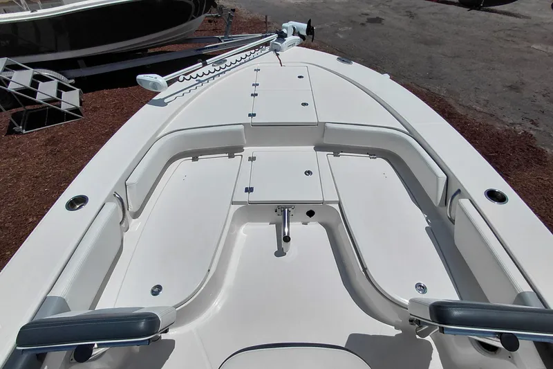Slide: The Image of 2023 Robalo 246 Cayman boat interior with spacious seating and storage compartments. - 15