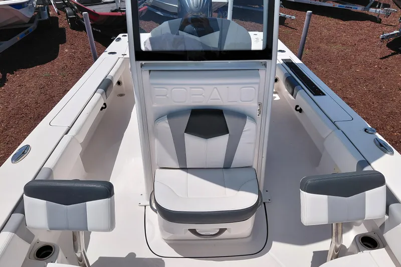 Slide: The Image of 2023 Robalo 246 Cayman boat interior with white and gray seating. - 20