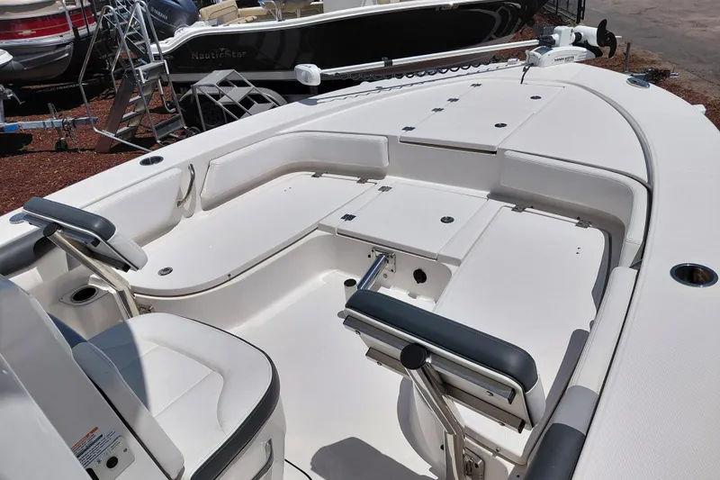 Slide: The Image of 2023 Robalo 246 Cayman boat interior with seating and storage compartments. - 22