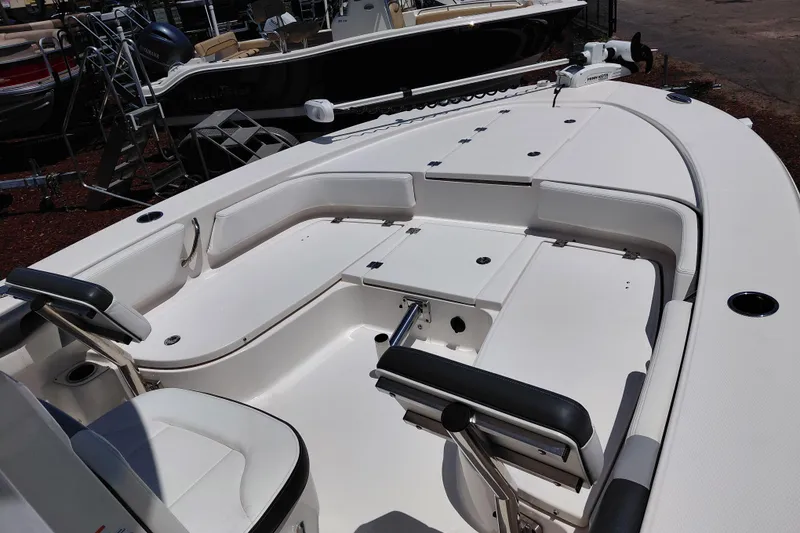 Slide: The Image of 2023 Robalo 246 Cayman boat interior with seating and storage compartments. - 23