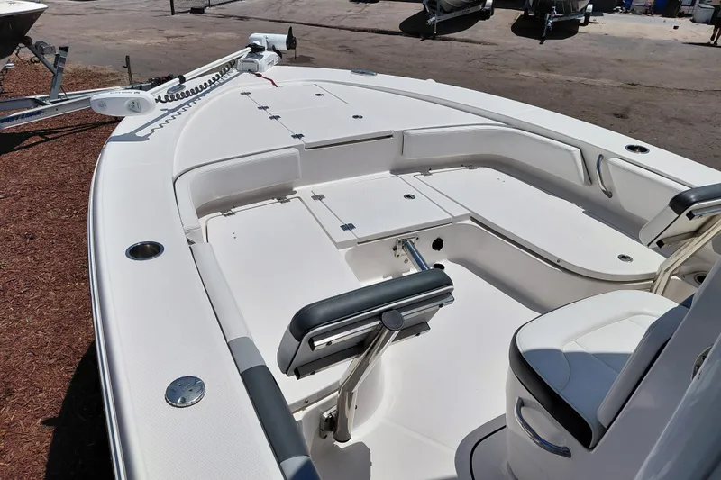 Slide: The Image of 2023 Robalo 246 Cayman boat interior with seating and storage compartments. - 24
