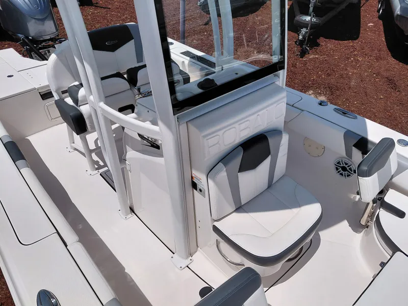 Slide: The Image of 2023 Robalo 246 Cayman boat interior with seating and console details. - 29