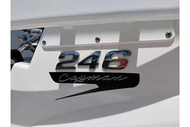 Slide: The Image of 2023 Robalo 246 Cayman boat emblem with chrome lettering on white background. - 30