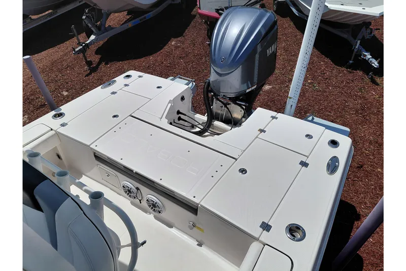Slide: The Image of 2023 Robalo 246 Cayman boat with Yamaha outboard motor, featuring spacious deck layout. - 44