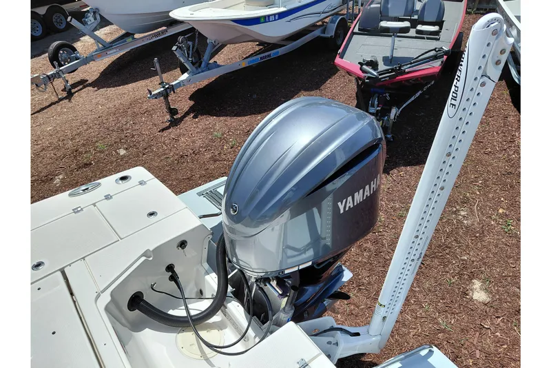 Slide: The Image of 2023 Robalo 246 Cayman boat with Yamaha outboard motor and Power-Pole anchor system. - 52