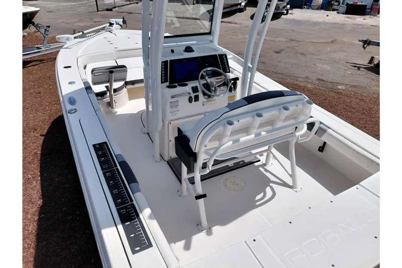 Slide: The Image of 2023 Robalo 246 Cayman boat interior with steering console and seating. - 53