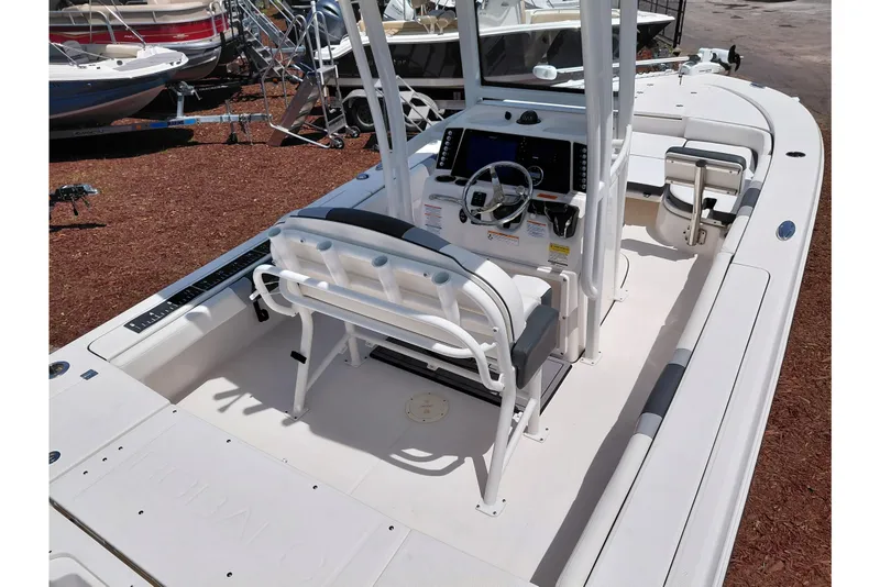 Slide: The Image of 2023 Robalo 246 Cayman boat interior with helm and seating area. - 54