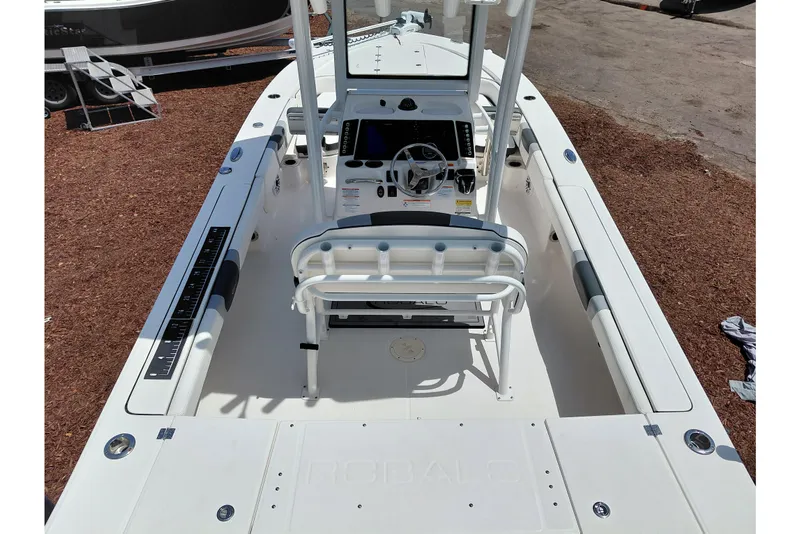 Slide: The Image of 2023 Robalo 246 Cayman boat interior with steering console and seating. - 56