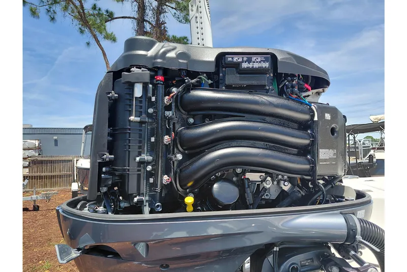 Slide: The Image of 2023 Robalo 246 Cayman boat engine, detailed view under sunny sky. - 59