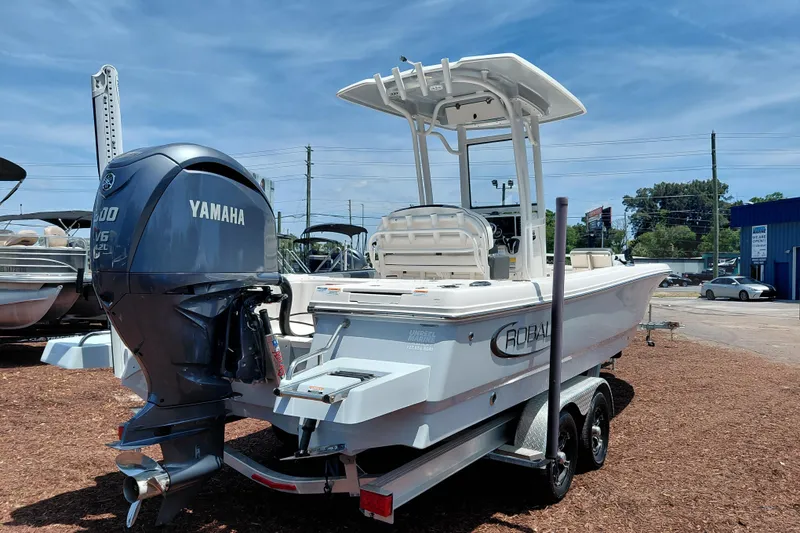 Slide: The Image of 2023 Robalo 246 Cayman boat with Yamaha engine on trailer, outdoor display. - 7