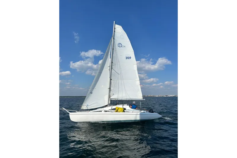 The Image of Sailing Corsair F-24 MkII trimaran on open water under clear blue sky, 2000 model. - 1