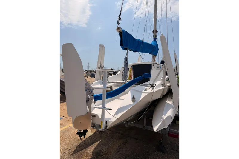 Slide: The Image of 2000 Corsair F-24 MkII sailboat on trailer, featuring blue sail covers. - 4