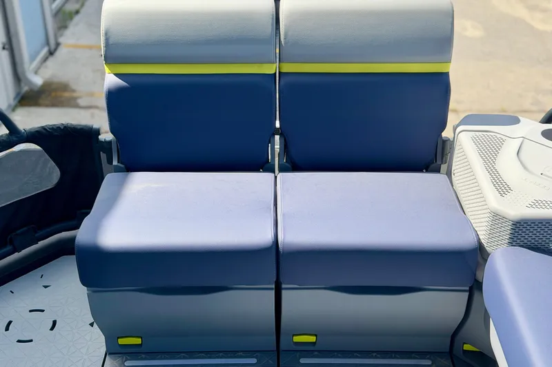 Slide: The Image of 2026 Sea-Doo Switch Cruise Limited 21 seating, featuring blue and gray cushioned seats. - 10