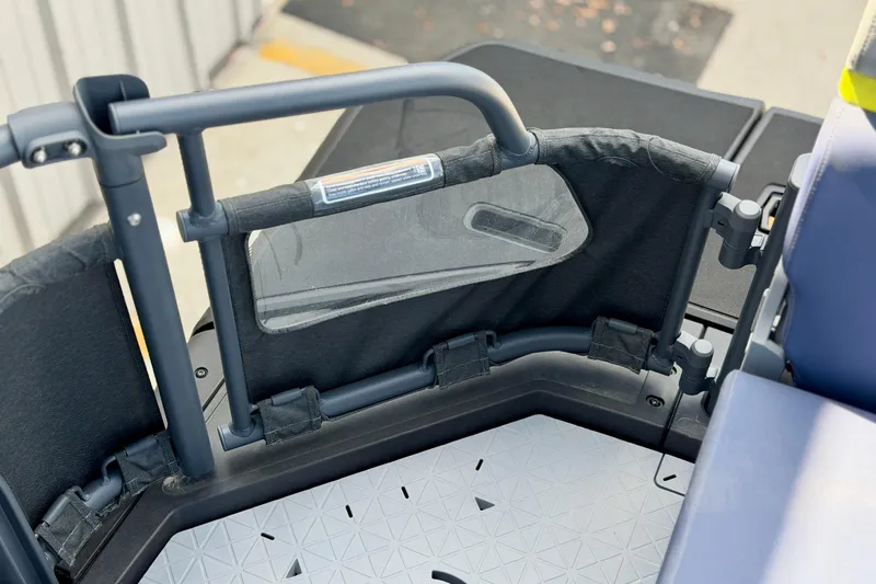 Slide: The Image of 2026 Sea-Doo Switch Cruise Limited 21 interior detail, featuring seating and safety railing. - 16