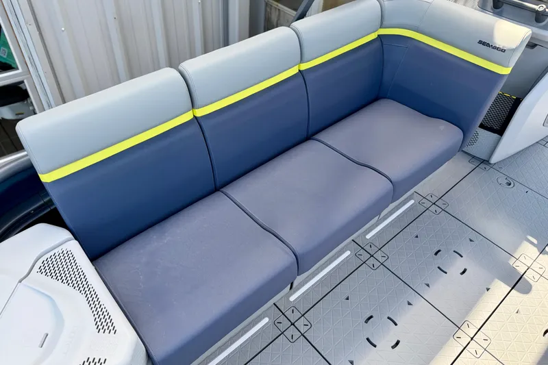 Slide: The Image of 2026 Sea-Doo Switch Cruise Limited 21 seating area with blue and gray upholstery. - 2