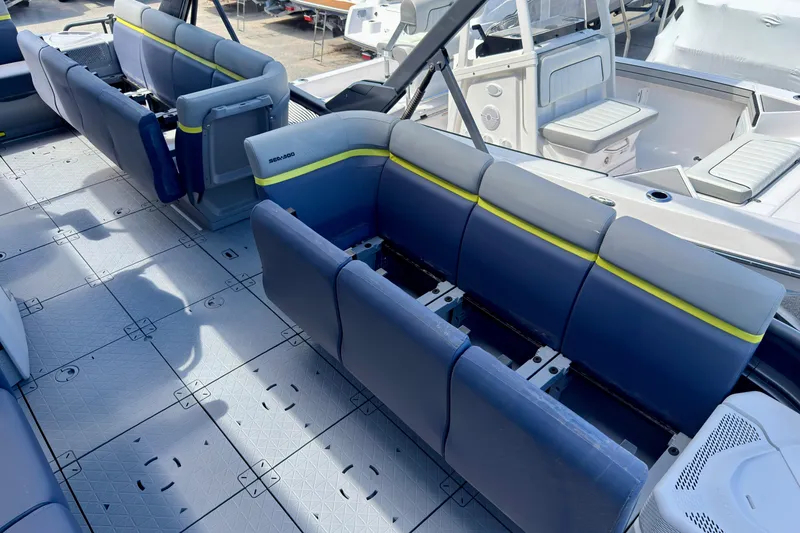 Slide: The Image of 2026 Sea-Doo Switch Cruise Limited 21 interior with modular seating and spacious deck layout. - 23