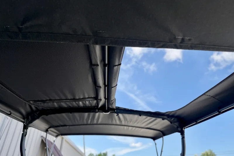 Slide: The Image of 2026 Sea-Doo Switch Cruise Limited 21 canopy against a clear blue sky. - 6