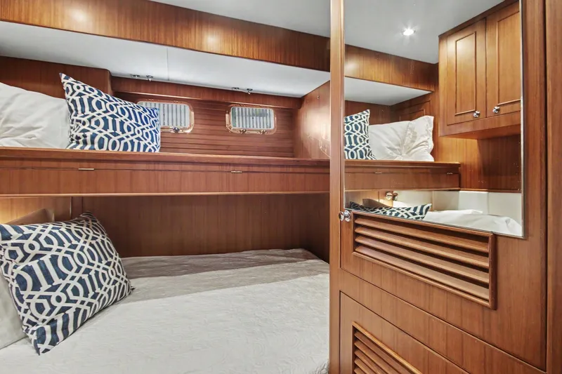 Slide: The Image of Luxurious cabin interior of 2022 North Pacific 45 Pilothouse yacht with wooden finish. - 24