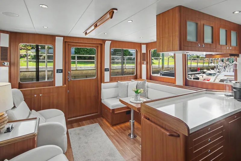 Slide: The Image of Luxurious interior of 2022 North Pacific 45 Pilothouse yacht with elegant wood finishes. - 31