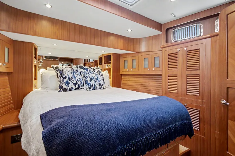 Slide: The Image of Luxurious cabin interior of 2022 North Pacific 45 Pilothouse yacht with cozy bedding. - 28