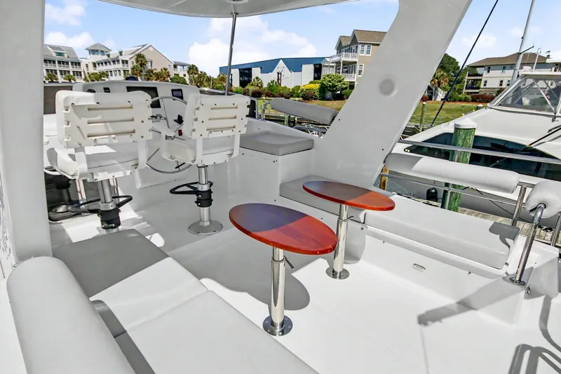 Slide: The Image of Luxurious 2022 North Pacific 45 Pilothouse yacht interior with seating and helm station. - 43