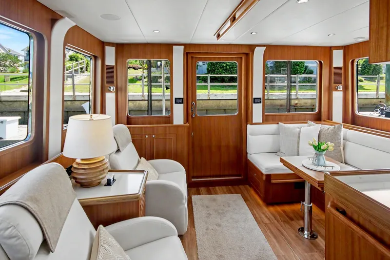 Slide: The Image of Luxurious interior of 2022 North Pacific 45 Pilothouse yacht with elegant seating and decor. - 32