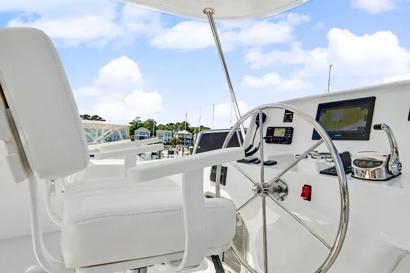 Slide: The Image of Pilothouse of 2022 North Pacific 45 yacht with steering wheel and navigation equipment. - 38