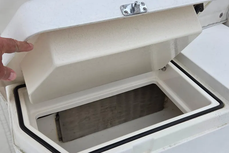 Slide: The Image of Open storage compartment on a 1999 Cabo 35 Express boat. - 13