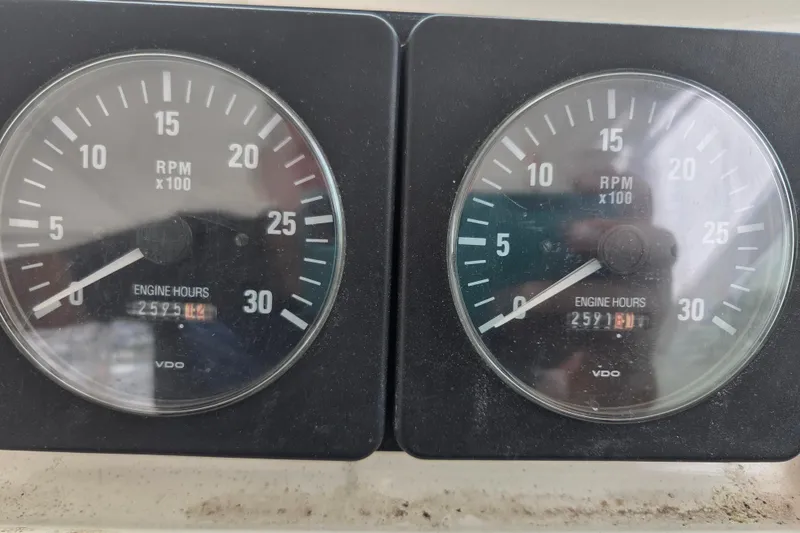 Slide: The Image of RPM gauges of a 1999 Cabo 35 Express boat showing engine hours. - 20