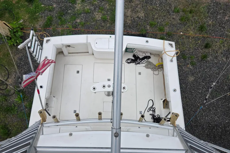 Slide: The Image of Overhead view of 1999 Cabo 35 Express boat deck with fishing gear. - 38