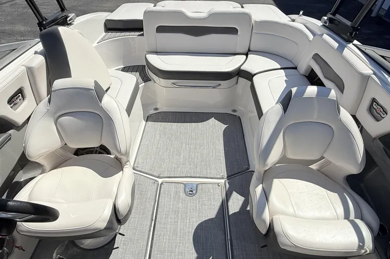 Slide: The Image of Interior of a 2016 Chaparral 246 SSi boat with white seating and modern design. - 11