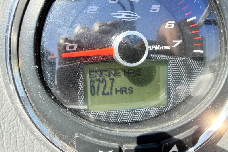 Slide: The Image of Close-up of 2016 Chaparral 246 SSi tachometer showing 672.7 engine hours. - 21