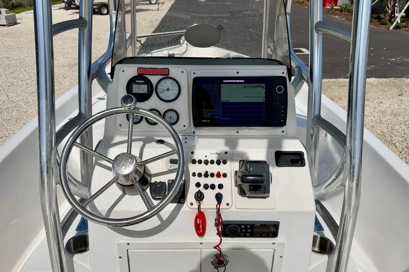 Slide: The Image of 2010 NauticStar 2110 Nautic Bay boat console with steering wheel and navigation equipment. - 11