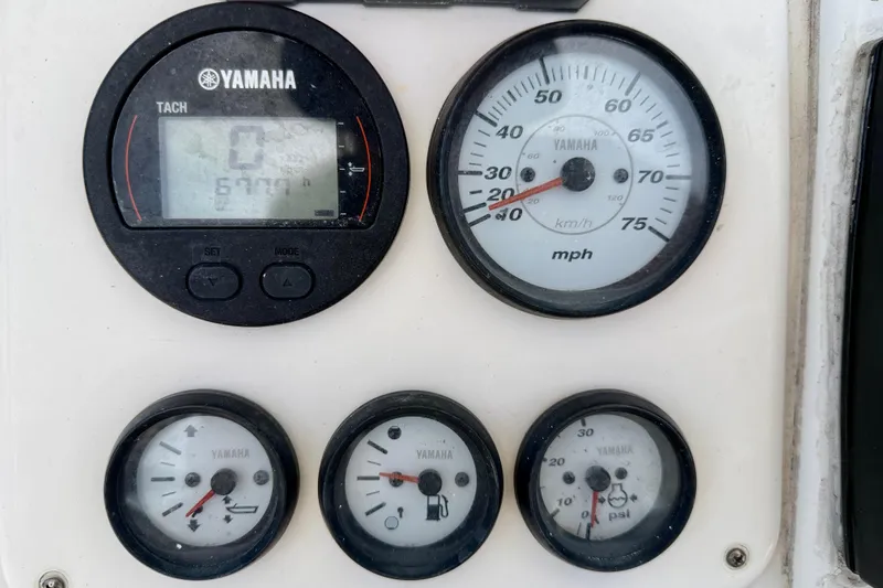 Slide: The Image of Dashboard of a 2010 NauticStar 2110 Nautic Bay boat with Yamaha gauges. - 14