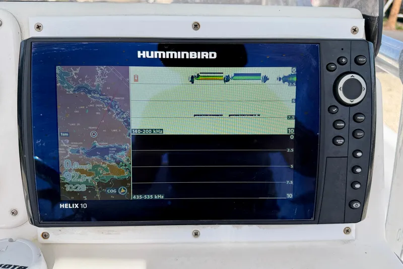 Slide: The Image of Humminbird Helix 10 fishfinder on 2010 NauticStar 2110 Nautic Bay boat dashboard. - 16