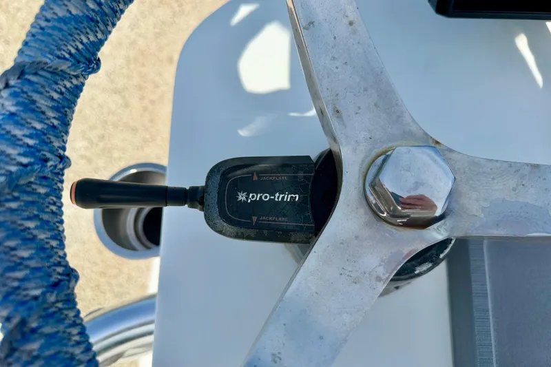 Slide: The Image of Steering wheel and Pro-Trim control on a 2010 NauticStar 2110 Nautic Bay boat. - 21