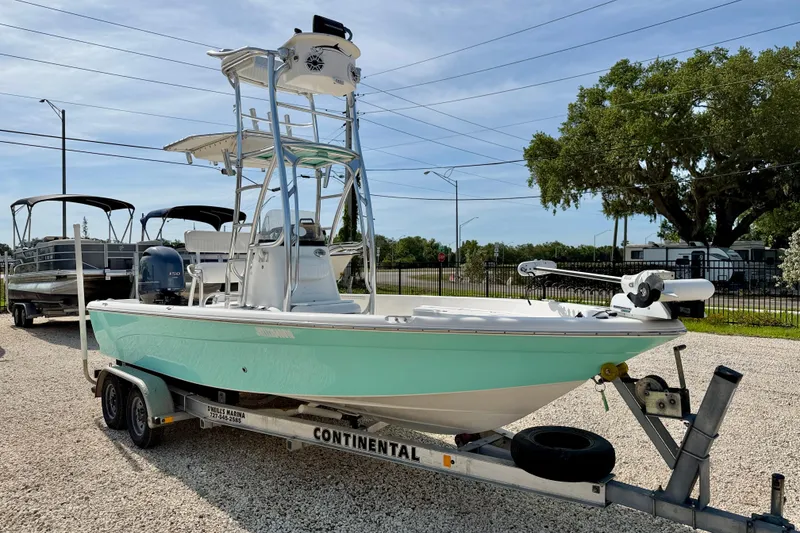 Slide: The Image of 2010 NauticStar 2110 Nautic Bay boat on trailer, parked outdoors. - 3