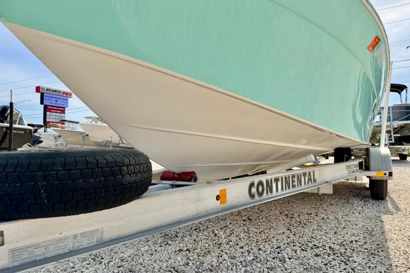 Slide: The Image of 2010 NauticStar 2110 Nautic Bay boat on Continental trailer, displayed outdoors. - 33