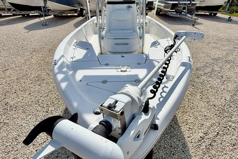 Slide: The Image of 2010 NauticStar 2110 Nautic Bay boat with trolling motor on gravel lot. - 8