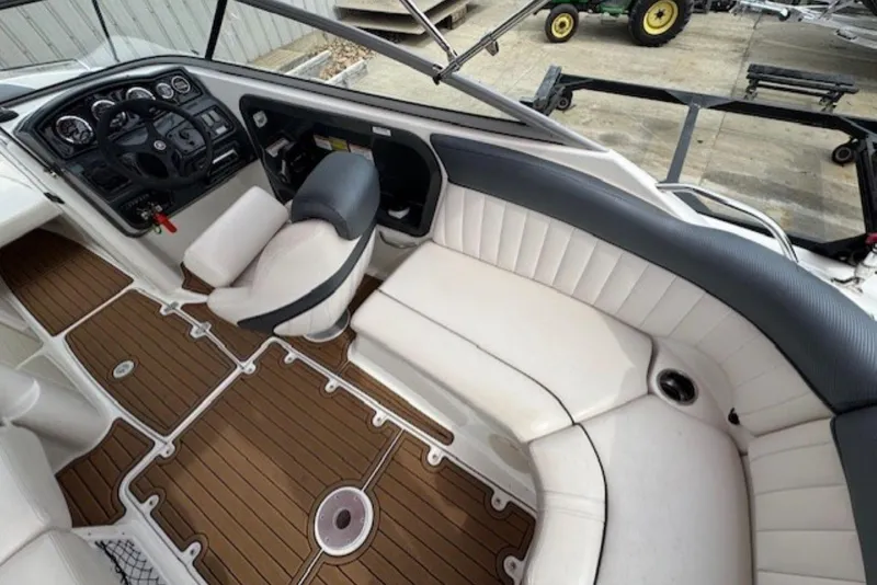 Slide: The Image of 2008 Yamaha Boats SX230 HO interior with white seating and wood-patterned flooring. - 10
