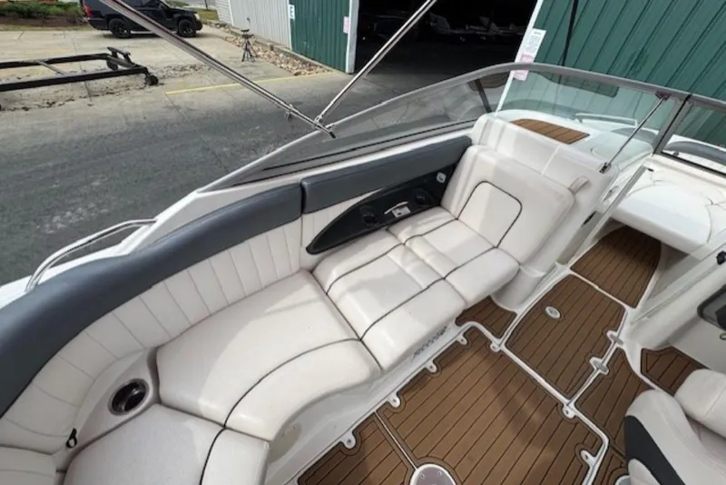 Slide: The Image of 2008 Yamaha Boats SX230 HO interior with white seating and brown flooring. - 11