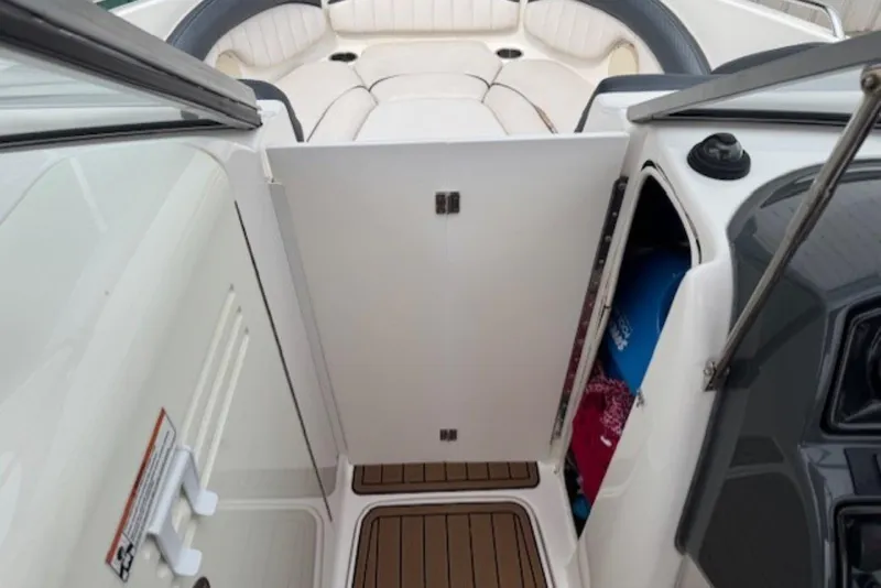 Slide: The Image of 2008 Yamaha Boats SX230 HO interior with open storage compartment and seating area. - 13
