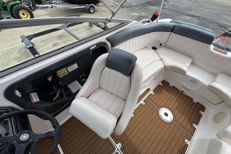 Slide: The Image of 2008 Yamaha Boats SX230 HO interior with white seating and wood-style flooring. - 14