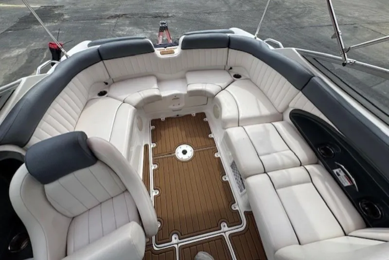 Slide: The Image of 2008 Yamaha Boats SX230 HO interior with white seating and wood-style flooring. - 16