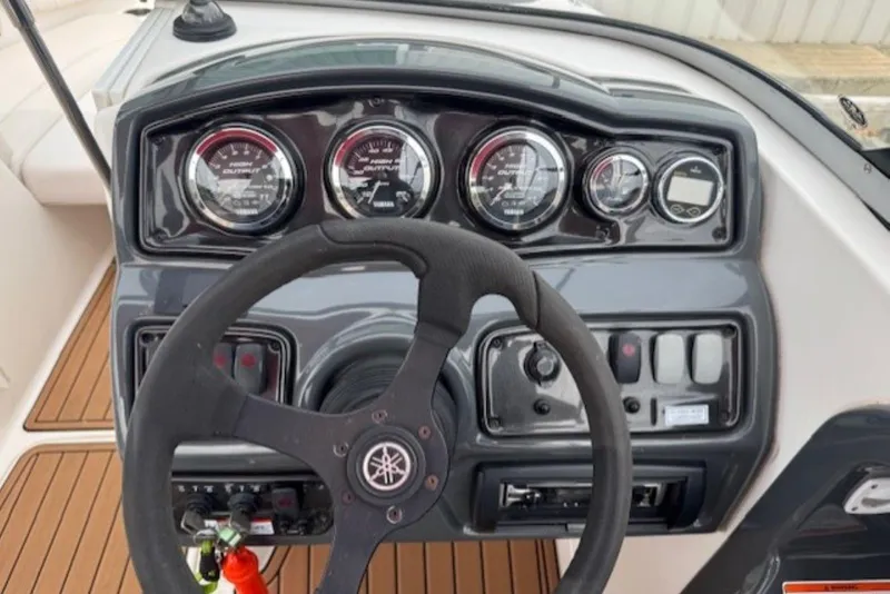 Slide: The Image of 2008 Yamaha Boats SX230 HO dashboard with steering wheel and instrument panel. - 19