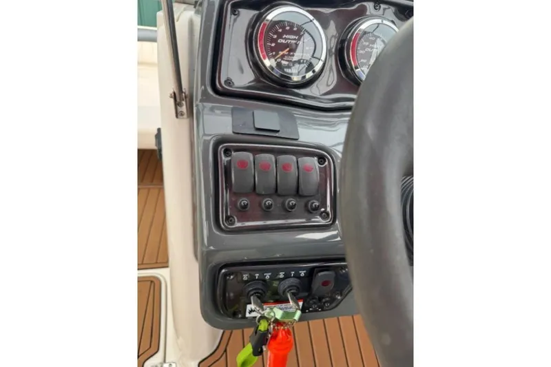 Slide: The Image of 2008 Yamaha Boats SX230 HO dashboard with gauges and control switches. - 21
