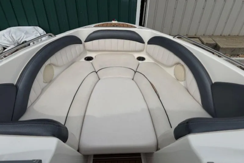 Slide: The Image of 2008 Yamaha Boats SX230 HO interior with cushioned seating and cup holders. - 22