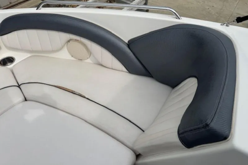 Slide: The Image of 2008 Yamaha Boats SX230 HO interior seating with white and gray upholstery. - 23