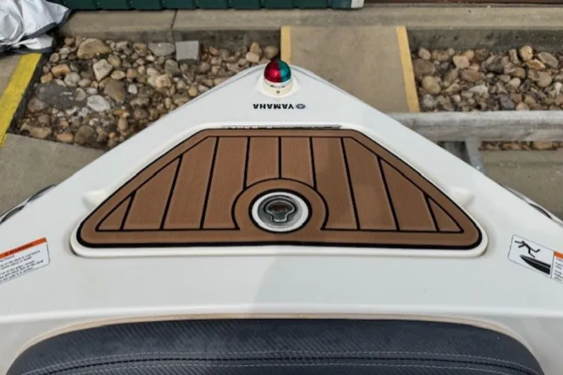 Slide: The Image of 2008 Yamaha Boats SX230 HO bow with teak-style decking and navigation light. - 25