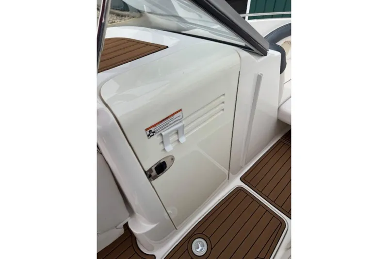 Slide: The Image of 2008 Yamaha Boats SX230 HO interior with white panel and brown flooring. - 27